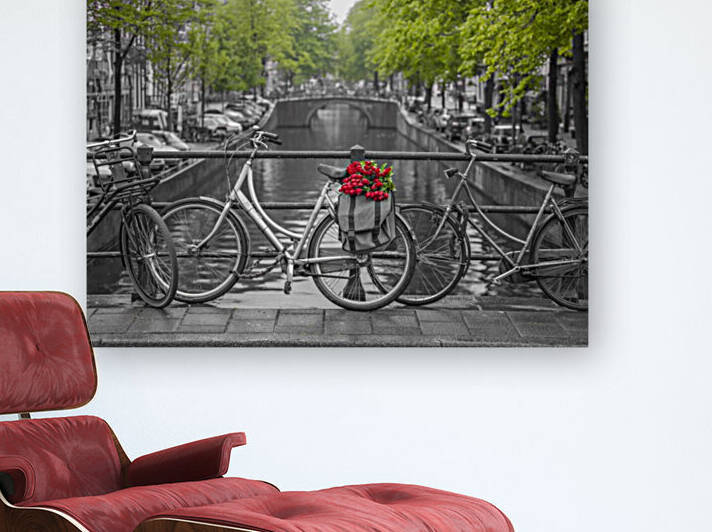 Bicycle with bunch of flowers by the canal, Amsterdam by Assaf Frank