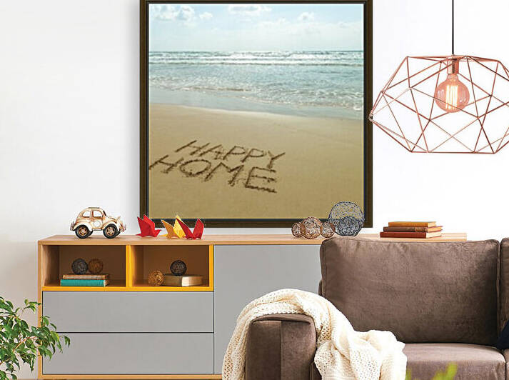 Happy Home written in sand on the beach by Assaf Frank