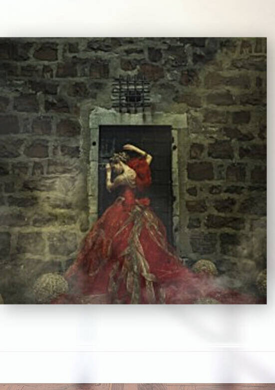 Rear view of a beautiful young blonde woman wearing an elegant red and gold princess gown and golden jewels leaning against a dungeon door by Artmood Visualz