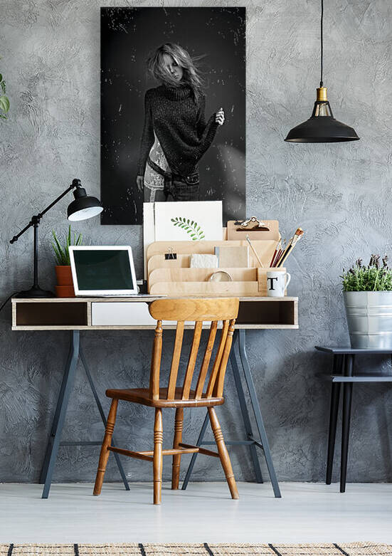 Black and white portrait of a blonde woman wearing both white lace lingerie and a wool sweater with a one-legged jean her hair floating in the wind by Artmood Visualz