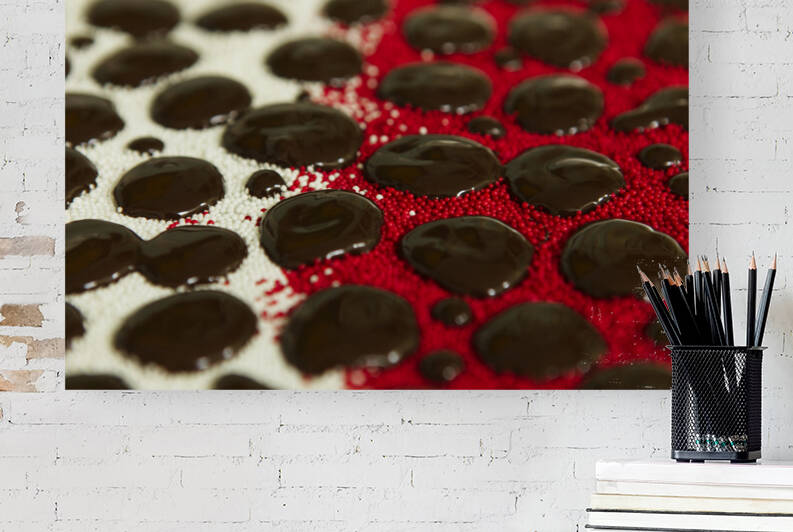 Chocolate Drops on Deep Red and White Nonpareils. by Iris H Richardson