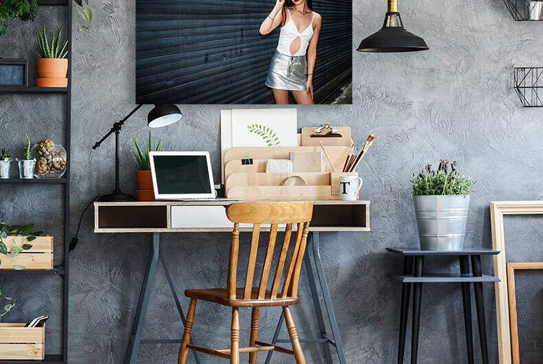 Young woman against a wall flash portrait by Philippe Lejeanvre
