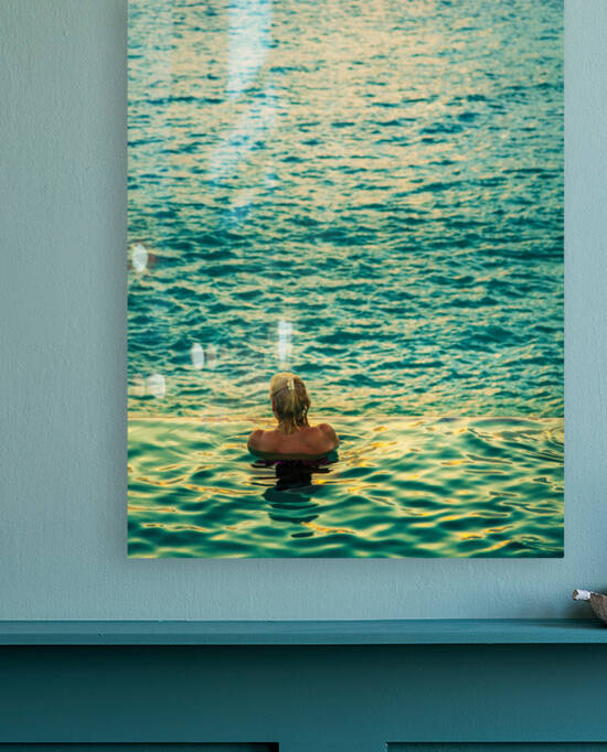 Womans head against infinity edge pool by Steve Heap