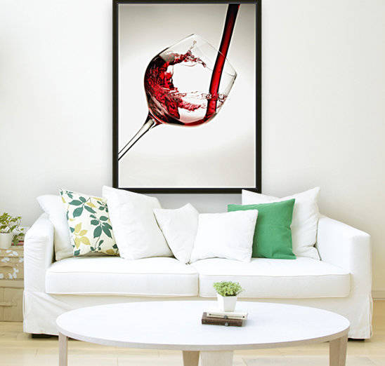 Red wine pouring into a glass by PacificStock