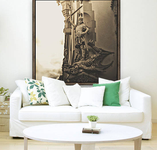 Statue on the side of a building of a warrior slaying a dragon; Prague, Czech Republic by PacificStock