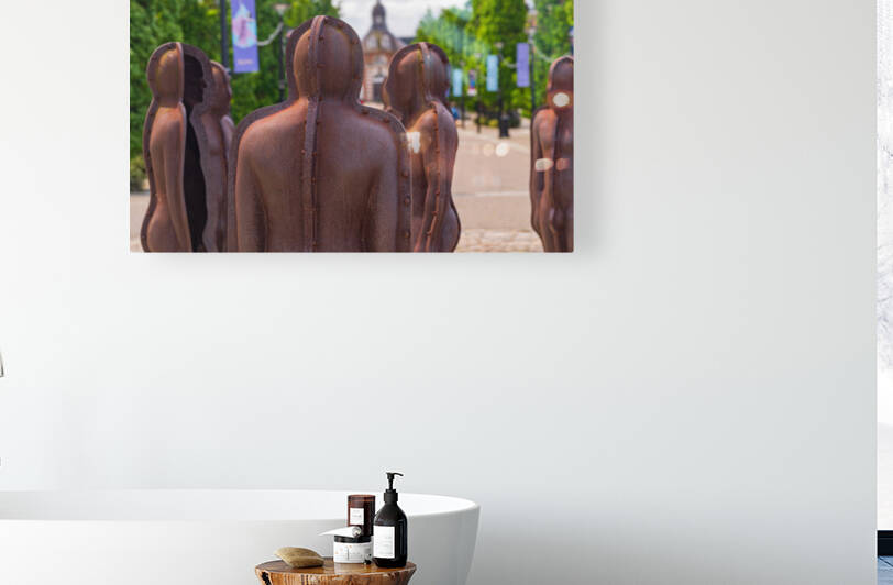 Iron scupltures of men in assembly in Royal Arsenal Riverside by Steve Heap