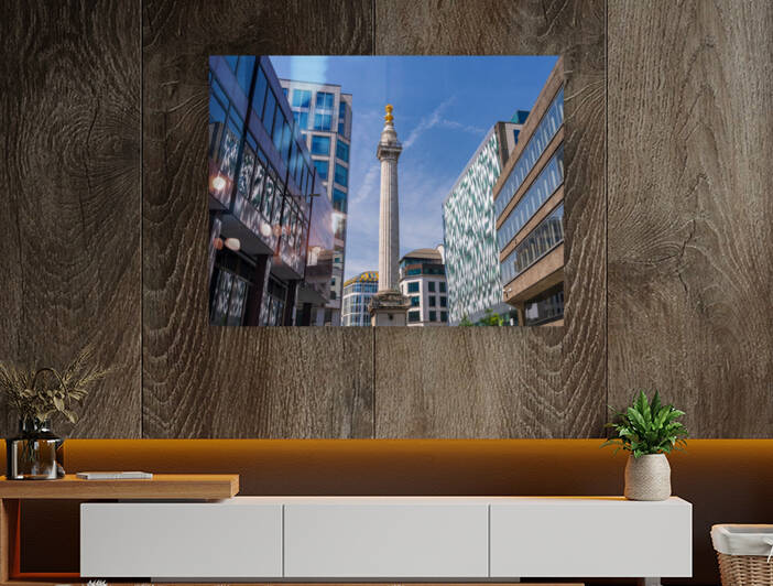 Modern office buildings surround the Monument in London by Steve Heap