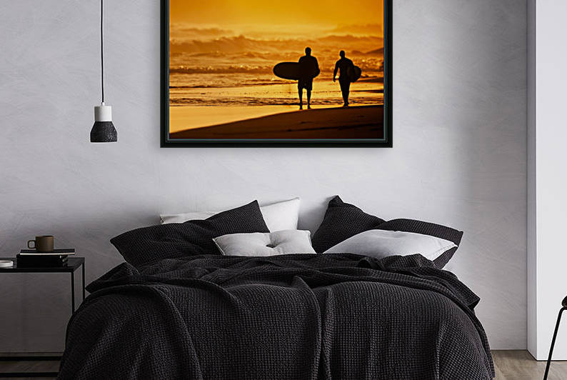 Silhouettes of Surfers on the Beach at Sunset by PacificStock