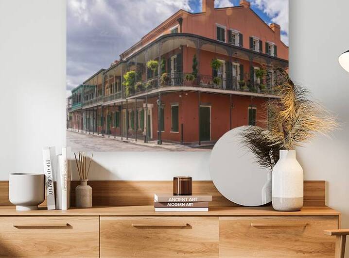 Traditional wrought iron balcony on ochre New Orleans house by Steve Heap