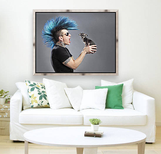 A Man With A Blue Mohawk Yells At His Dog by PacificStock