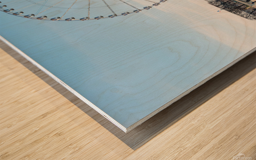 Paris ferris-wheel against blue sky from the Tuileries park Wood print