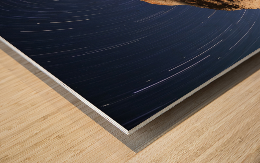Light painting on monolith and star trails, Anse des Bonnes Femmes at Ile Niapiskau, Mingan Archipelago National Park Reserve of Canada, Cote-Nord, Duplessis region; Quebec, Canada Wood print