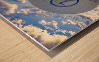 hot air balloon flies near the tourists over the hills of goreme Wood print