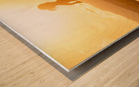 3 year old girl jumps into the sea at sunset. Wood print