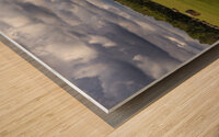 Haybales Under a Cloudy Sky Wood print