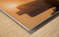 Man walking on a foot bridge against sunrise Wood print